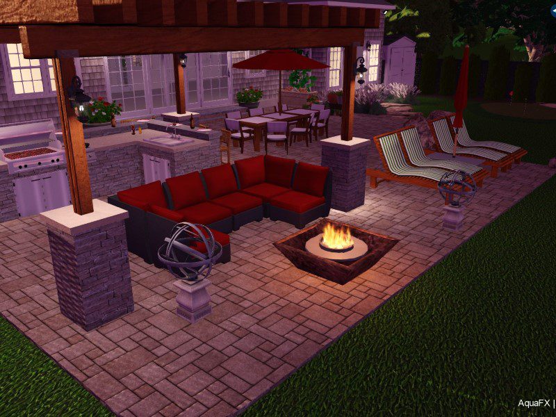 A patio with an outdoor fire pit and lounge chairs.