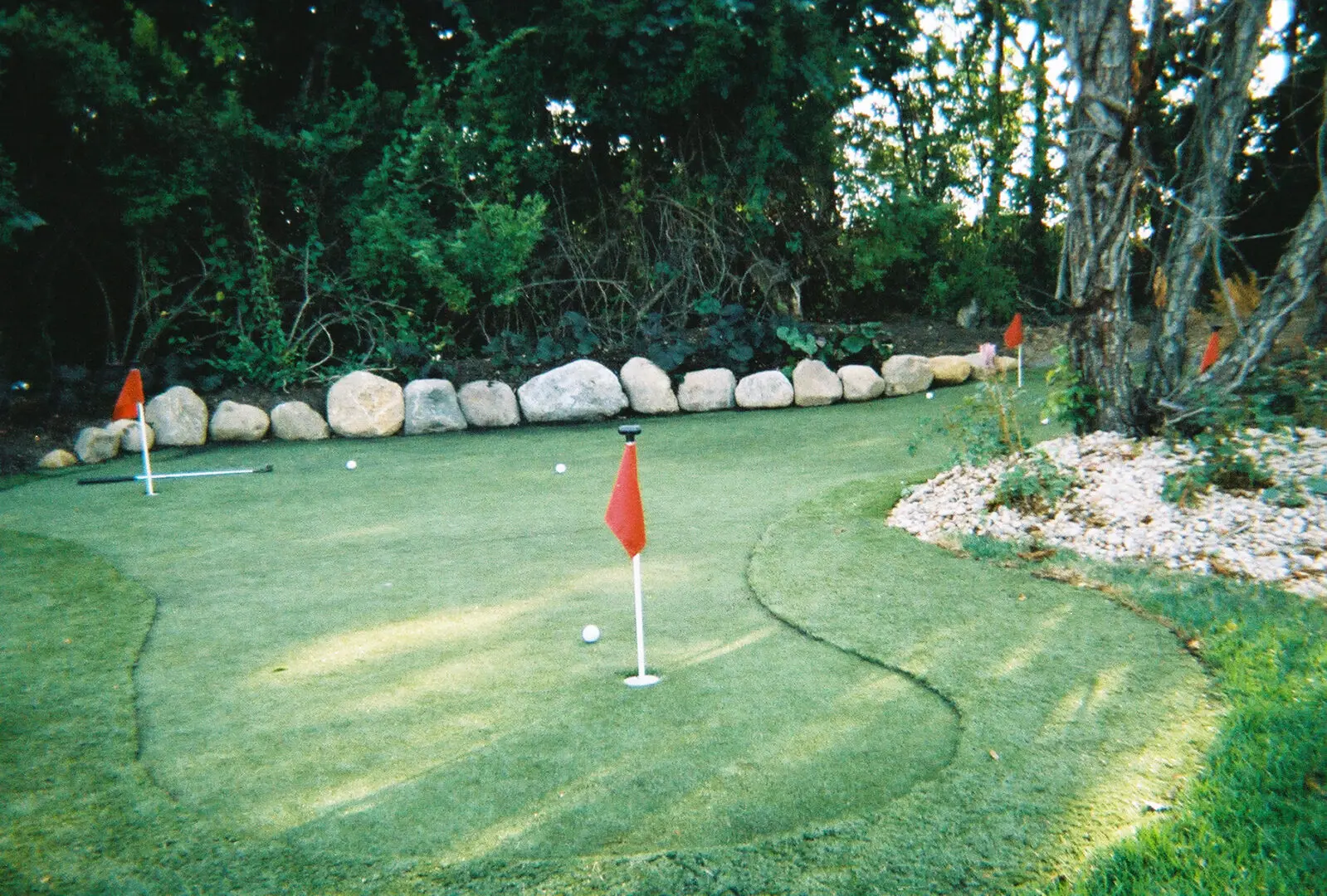 A golf course with some flags on the green