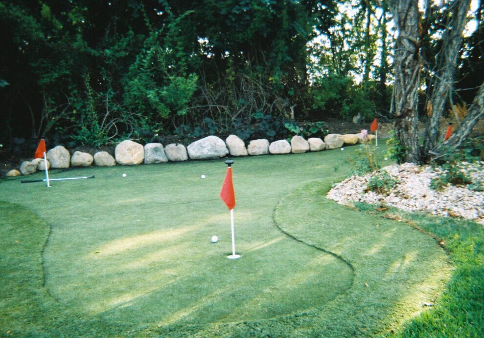 A golf course with some flags on the green